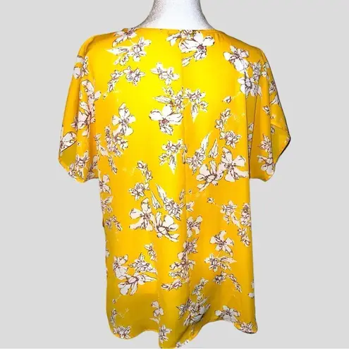 West Kei  pretty dark yellow twisted hem blouse with floral design! New