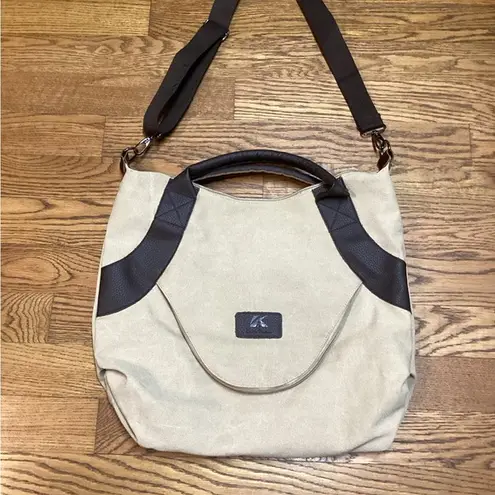 Classic Fashion Outback bag. Tan with pebbled leather handles and trim.