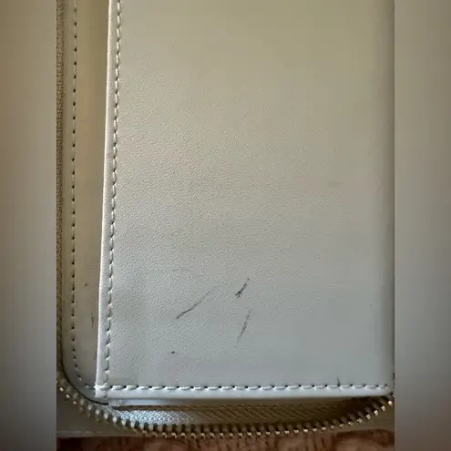 Women’s wristlet with gold accents and wrist strap Tan