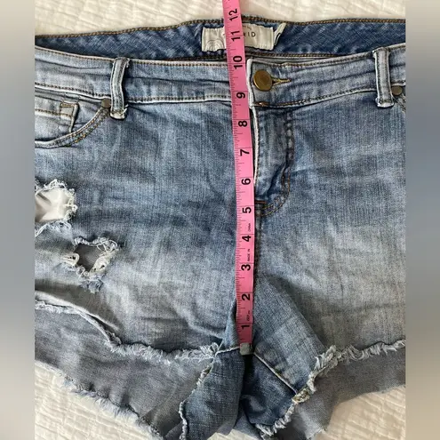 Torrid  Mid-Rise Distressed Raw Hem Medium Wash Denim Stretch Shorts Size 16