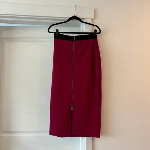 Bebe NWT  extreme zip front midi skirt in burgundy black ribbed