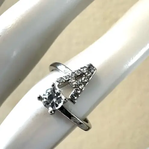 A monogram rhinestone ring Silver