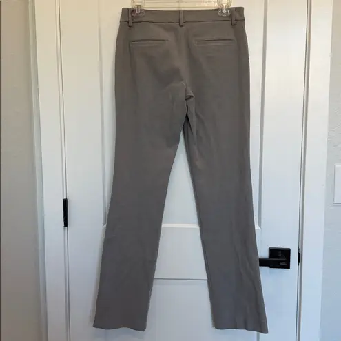 EXPRESS  Gray Trousers, Editor Barely Boot
