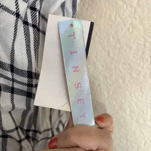 Black and White Smocked Blouse with Cap Sleeves and Rounded Neckline Size M