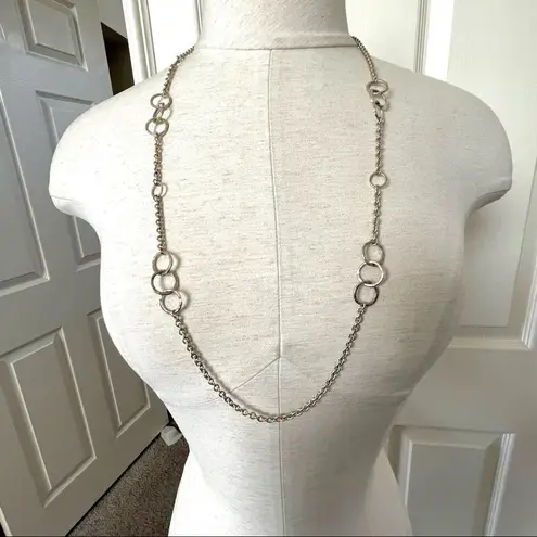 Long silver tone necklace with circles