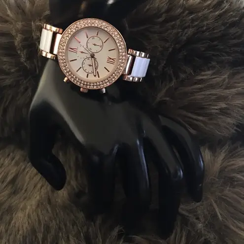 Ladies rose gold tone rhinestone cuff watch