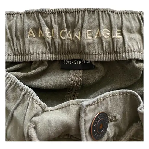 American Eagle -ARMY GREEN JOGGER PANTS-SIZE 2 Elastic waist with drawstring, zip front, two front and two back pockets, elastic ankles with a side zipper, excellent condition  Measurements: Waist: side to side 13-16 inches  Rise: 9 inches  Inseam: 37 inches