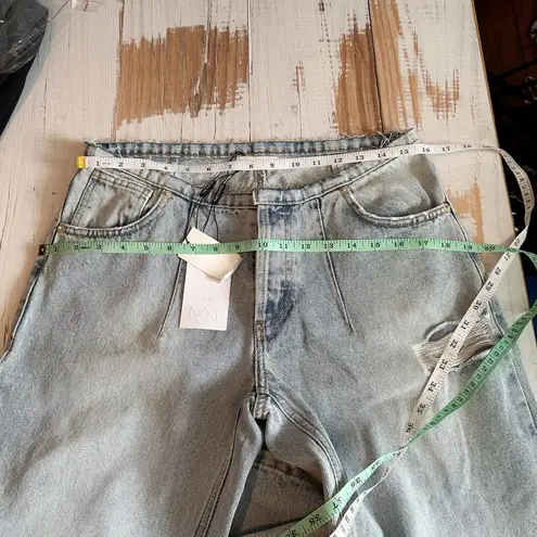 The MANNEI Low Rise Distressed Frayed Wide Leg Jeans
FR 40 Button Fly Blue Size 28