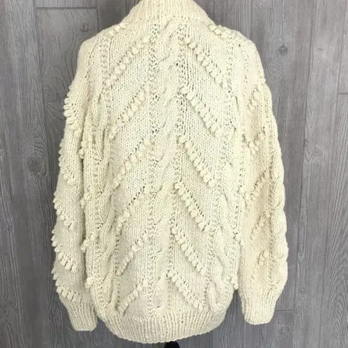 Handmade crochet cotton knitted sweater with pom poms and braids oversized