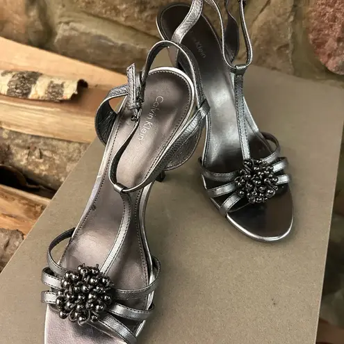 Calvin Klein  Metallic Silver Heels 10 M great shape-light peeling inside