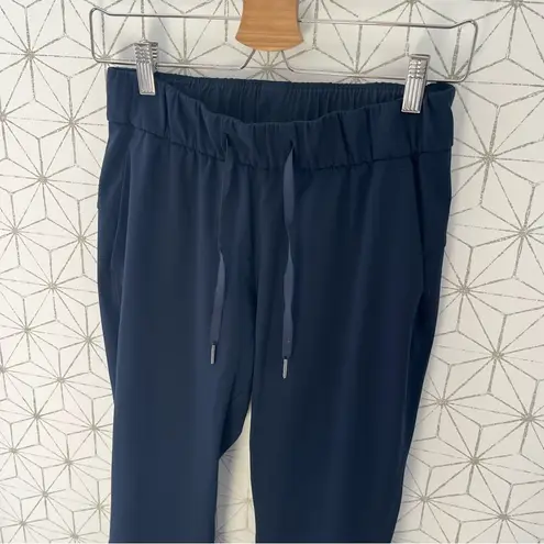Lululemon  On The Fly Pant *Woven 28"
True Navy