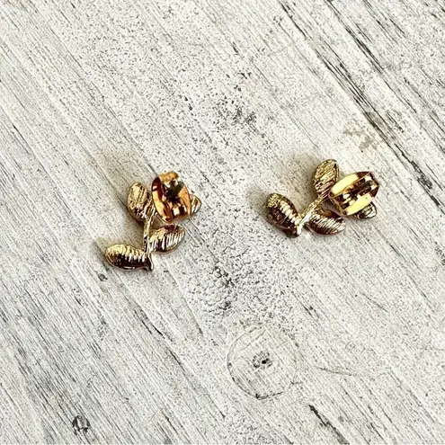 Small and dainty gold tone and purple post leaf earrings