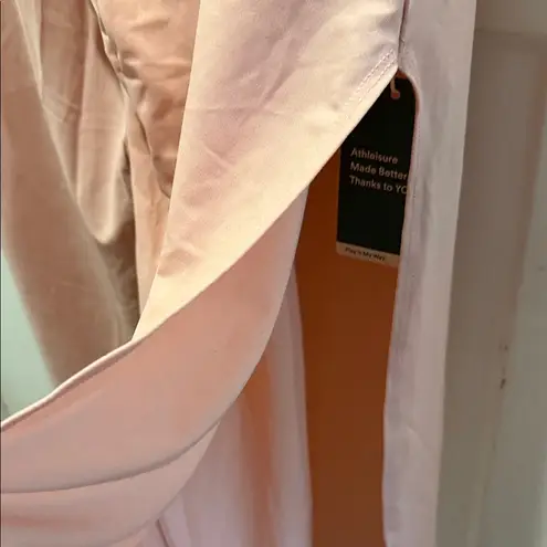 Halara NWT Pink Jumpsuit size S open, no waist def. Pockets. Pant side slit