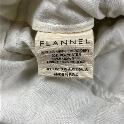 Flannel America Silver Sequin Pleated Skirt
Sz: 1 Size undefined