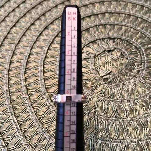 Miss Tina sz5.5 silver colored ring cutouts gold colored accent purple stone EUC