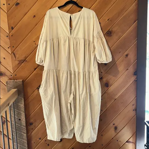 Black crane oversized puff jumpsuit in light clay color