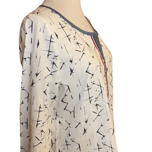 Ambria White w/ Blue Top that has blue and red trim, slits, silver buttons Size 8