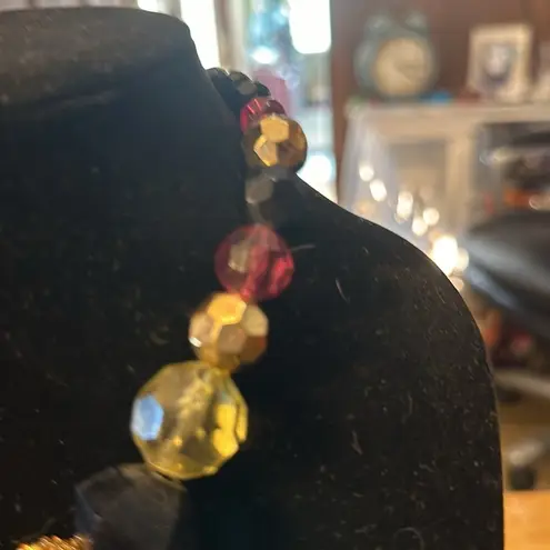 Beautiful vintage necklace. The seed beads are glass. rest of the beads plastic.