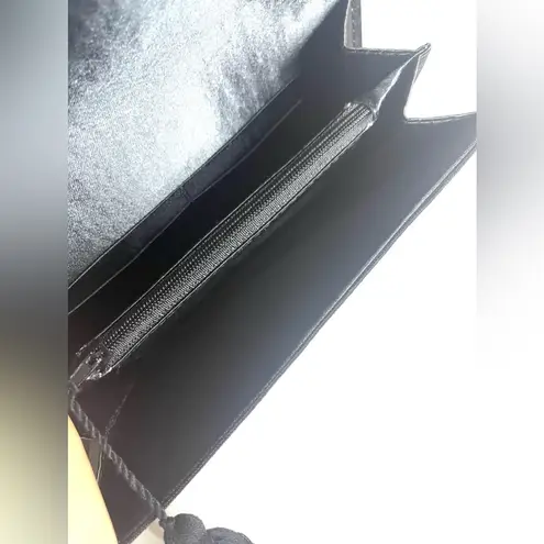 Tribal print and black small clutch black with tassel on the zipper snap closure