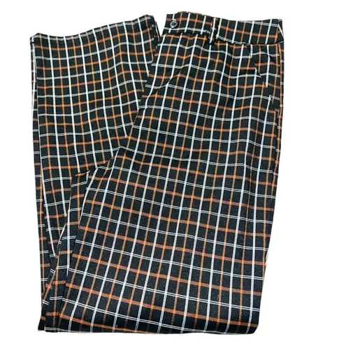 Full Tilt  cute fall look black slacks with orangish tan and white plaid.