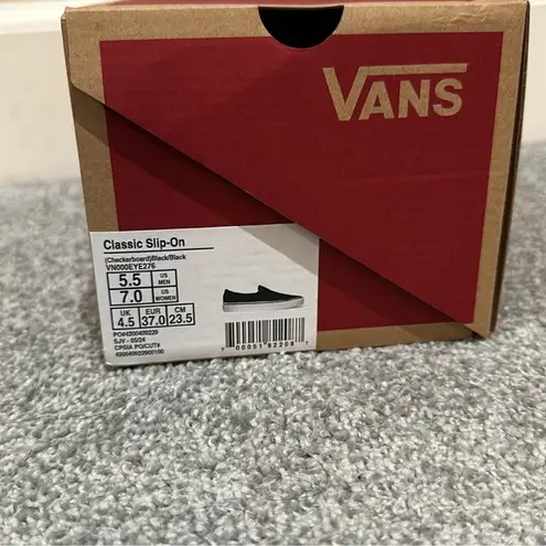 Vans  black checkered slip on sneakers