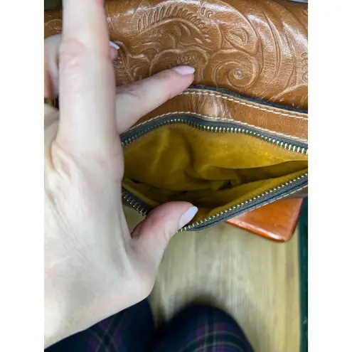 Patricia Nash Laurentina Tooled Leather Crossbody bag in a brown/tan color.