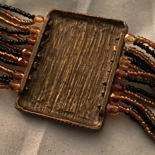 Vintage 9.25” Bracelet Multi Strand Beaded Rectangle Medallion 2” H Orange Black Gold