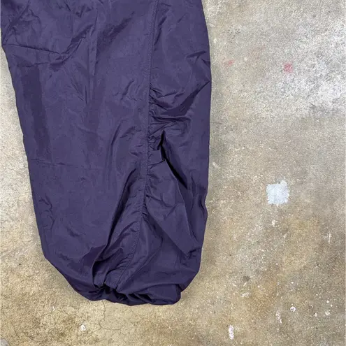 Athleta  Grace‎ Warm Up Pant Women’s XS Purple Nylon Wind Pants Cinch Hem Joggers
