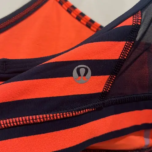 Lululemon  sports flow Y sports bra. Orange & blue stripes. Sea stripes color.