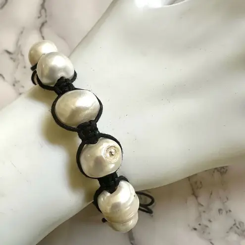 Pearl bracelet on adjustable black silk cord