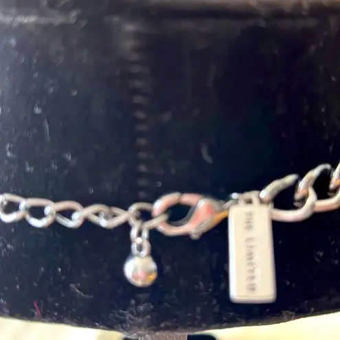 The Limited Black Oxidized Metal with Grey and Mirror-like Gems