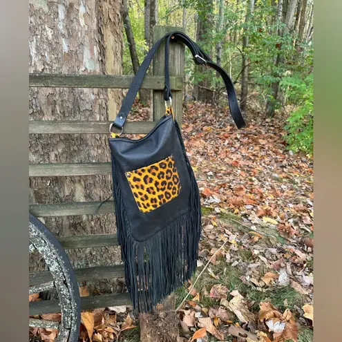 Leopard print with fringe crossbody purse with adj strap 10”x13” leather Brown