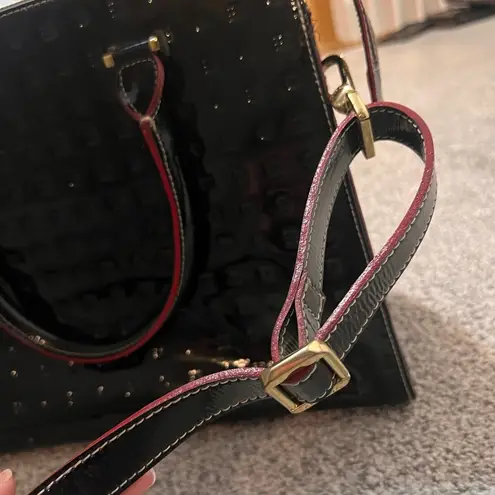 Like New Arcadia Black Leather Handbag with Red Accents.
