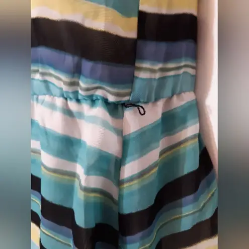 B. Wear striped one shoulder top