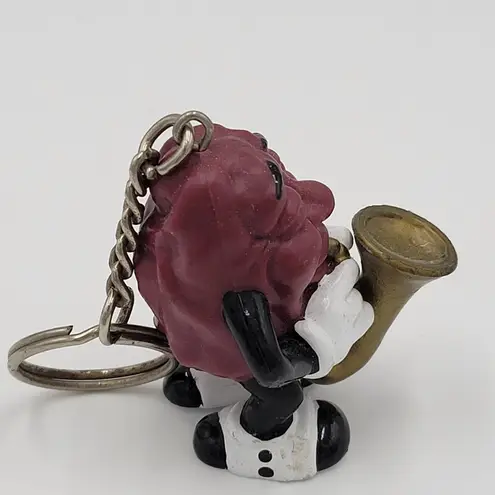 Raisin's California 1987 Vintage Raisin Saxophone Player Keychain
