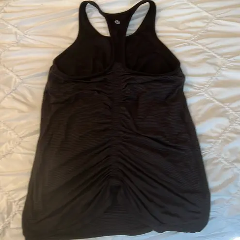 Lululemon Lululemmon black racerback tank top. Built in bra. Ruched back. Size 6