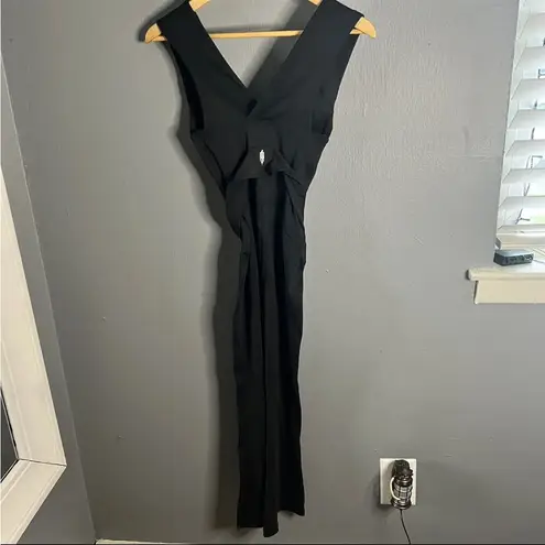 Free People  movement black deep v tie waist jumpsuit