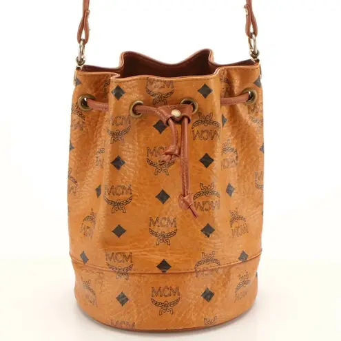 MCM COGNAC VISETOS COATED CANVAS LEATHER TRIM BUCKET BAG W/DRAWSTRING CLOSURE