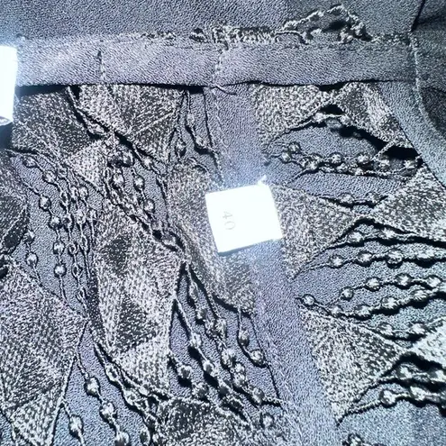 Sandro Noya wrap-effect macramé lace-paneled crepe jumpsuit EUR 40