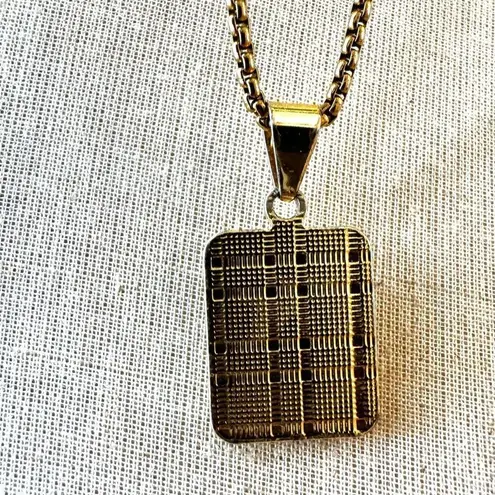 Gold tone A monogram pendant necklace