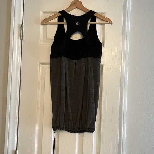 Lululemon Black and gray tank top with built in sports
bra.Size: 8.