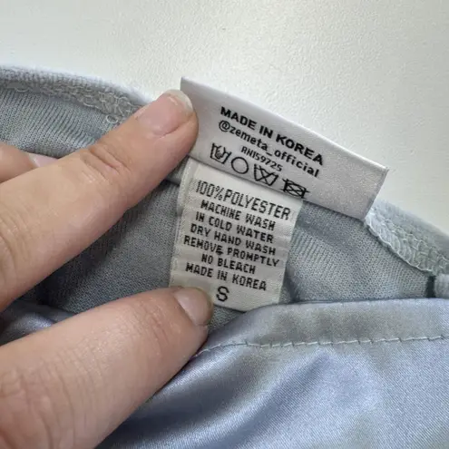 Zemeta Top Womens Small Blue Float Satin Ruffle Hem Crop Blouse Dolls Kill Blue