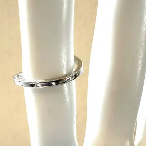 A monogram rhinestone ring Silver