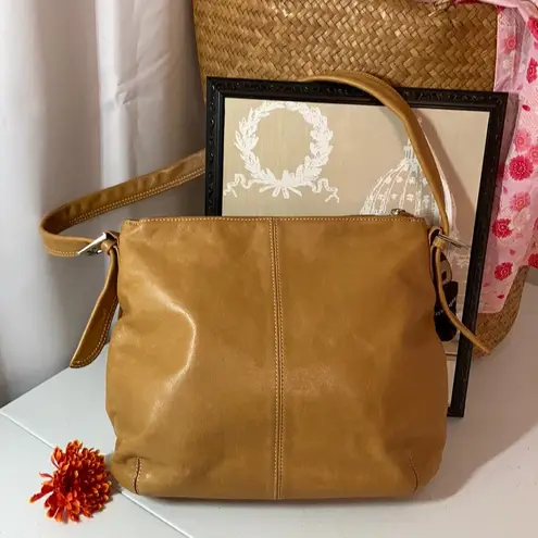 Tignanello genuine leather purse with many compartments.