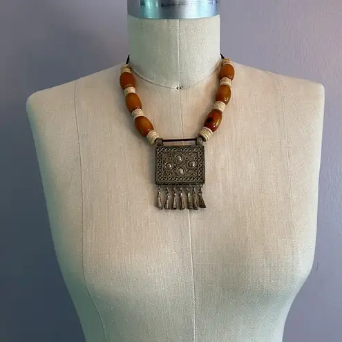 Handmade Vintage authentic African tribal necklace with metal center amber colored beads