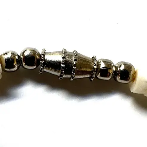 Green and white puka shell necklace