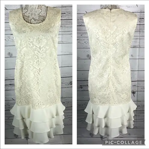 Leslie Fay  sleeveless 
Beautiful lace dress with layered ruffles on the end.