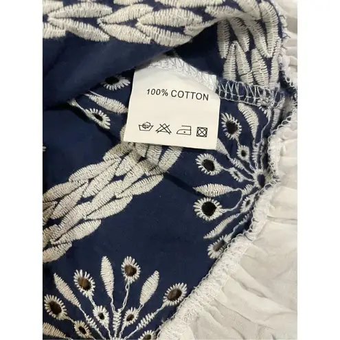 Velzera navy blue & white embroidered eyelet blouse with ruffle bottom hem & sle