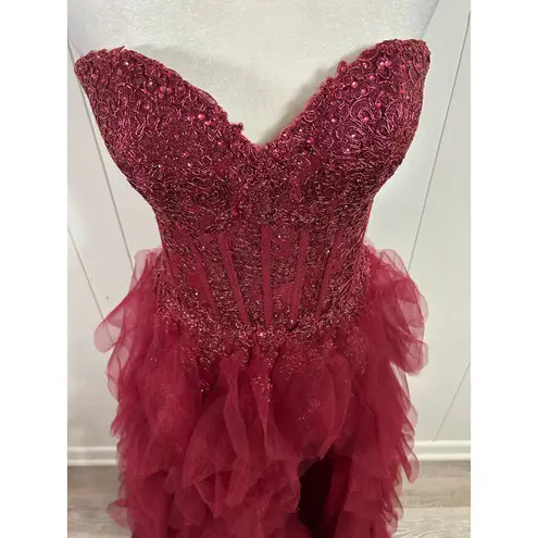 Prom Bay size 6 prom dress in the color wine. Corset with Lace up back & Ruffles Red