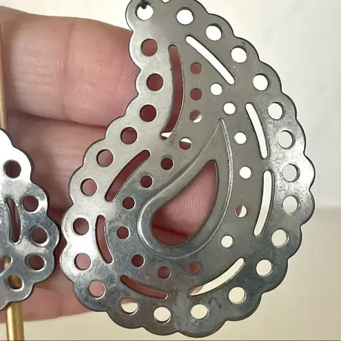 Silver tone paisley statement earrings